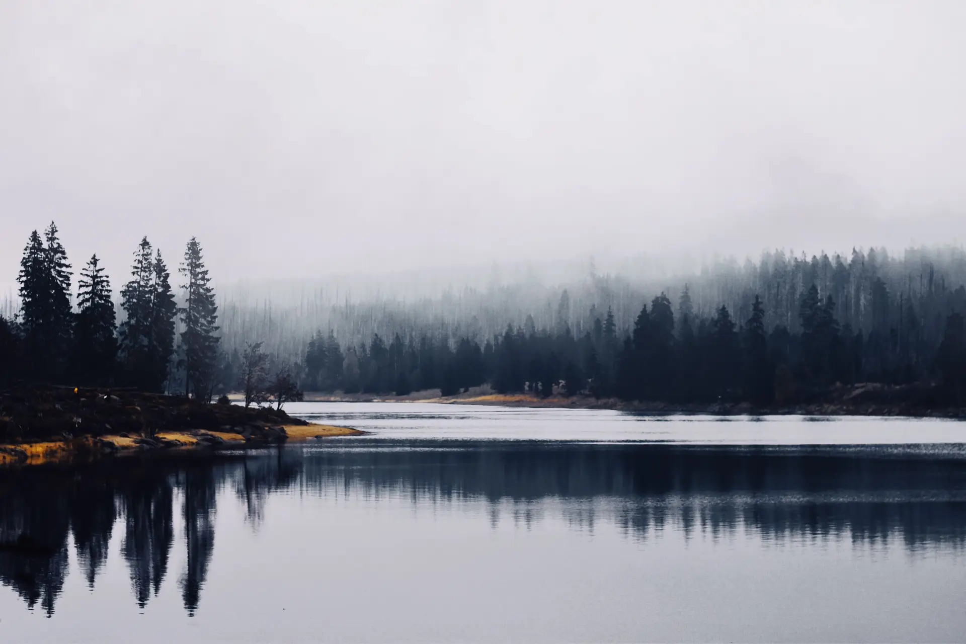 Spring thaw with gentle mist rising from melting lake waters